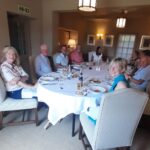 Stradia team members having lunch together in a restaurant